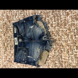 Jean shorts with gold pockets sticking out!